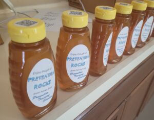 Honey bottled and labeled on a counter